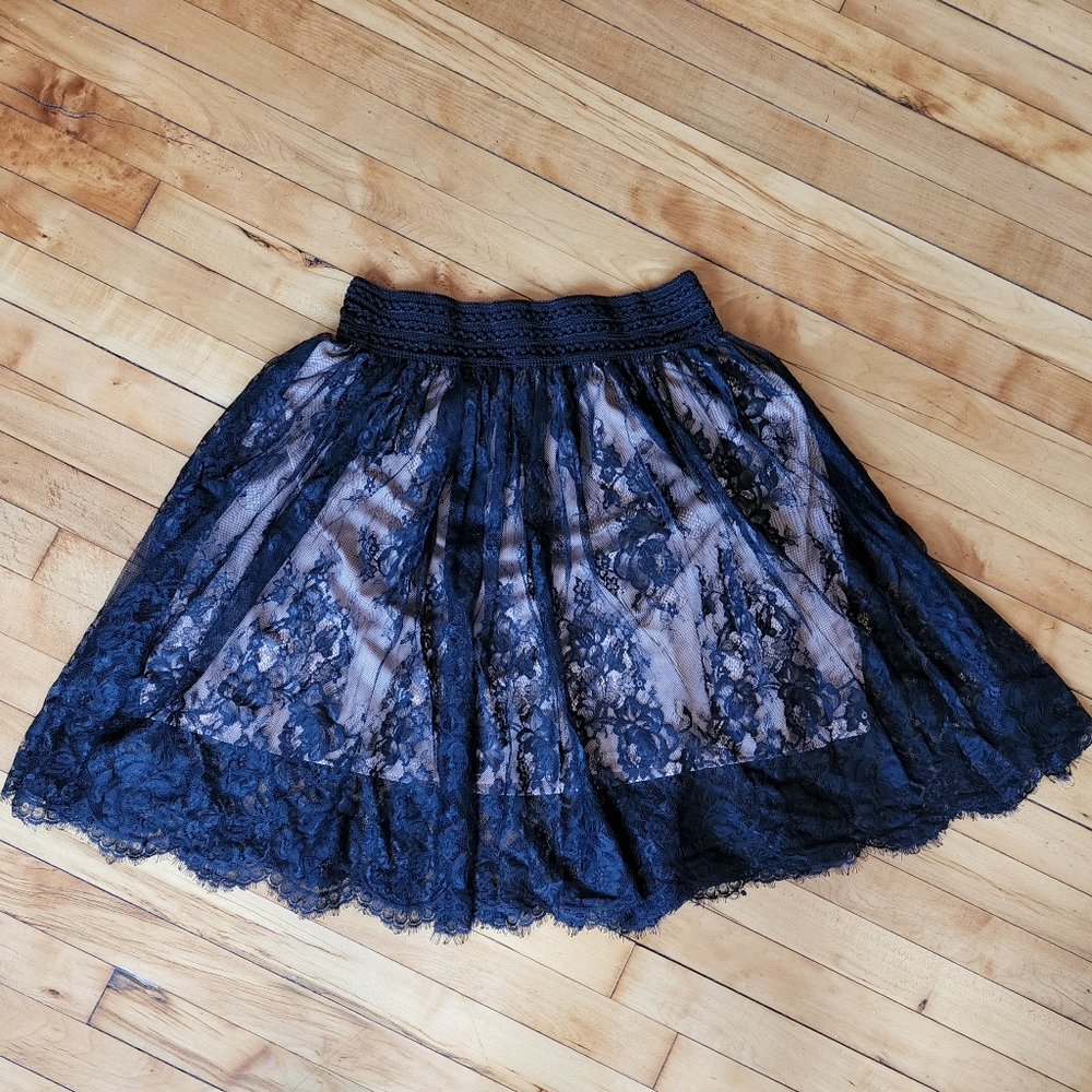 Black lace skirt with nude lining. Stretchy, size XL